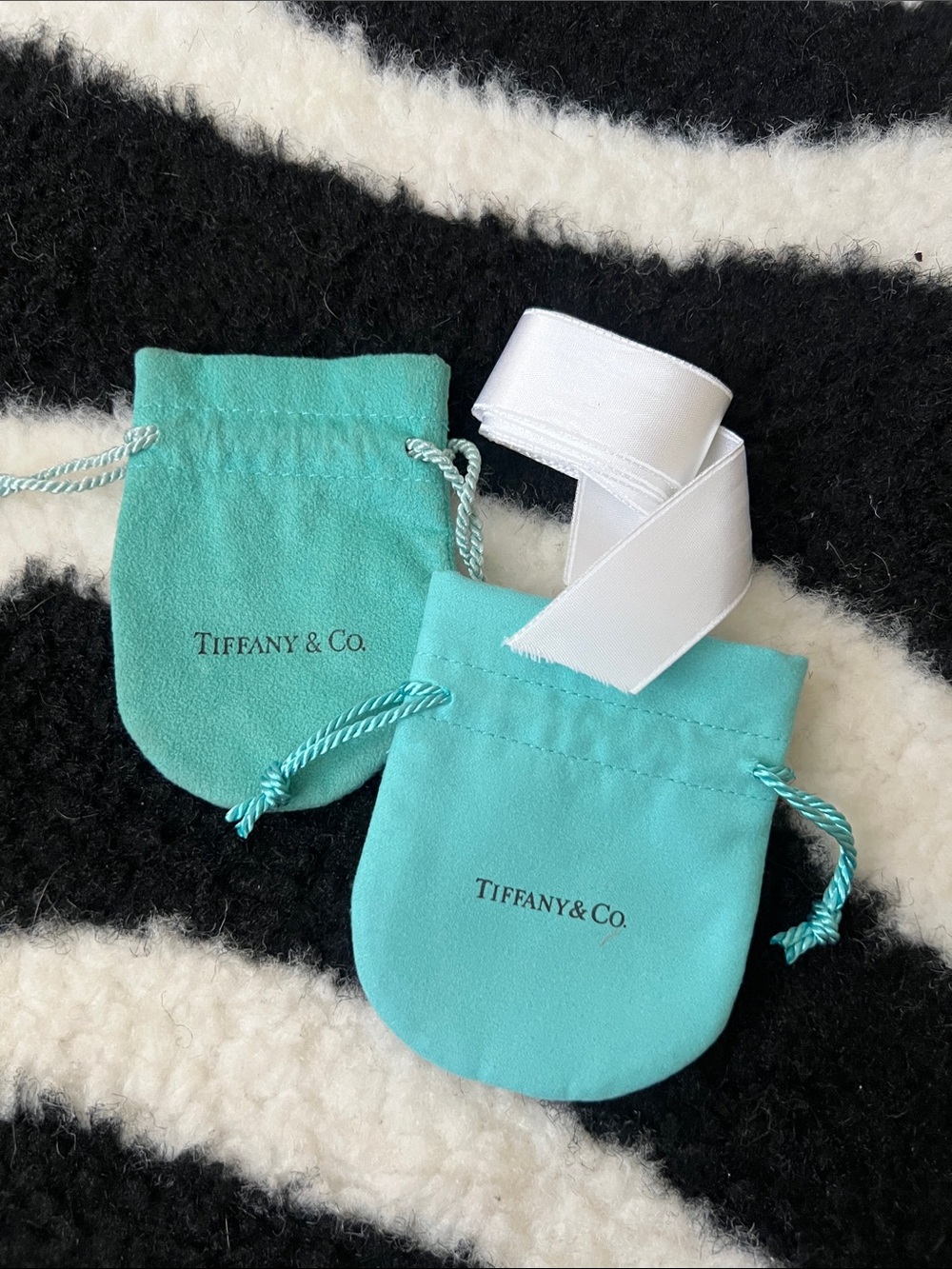 Bundle of Tiffany & Co bags and ribbon